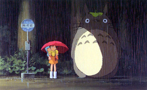 Totoro stuck in the rain with leaf on his head